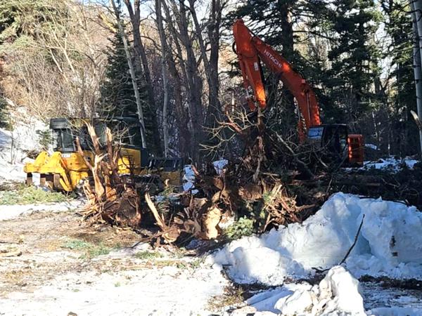 Snow can't stop us for cutting a new road by Chaparral Construction